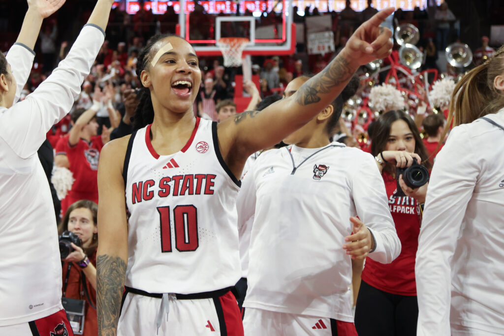 NC State's Aziaha James points to the crowd in celebration after defeating then-No. 1 Notre Dame on Sunday.