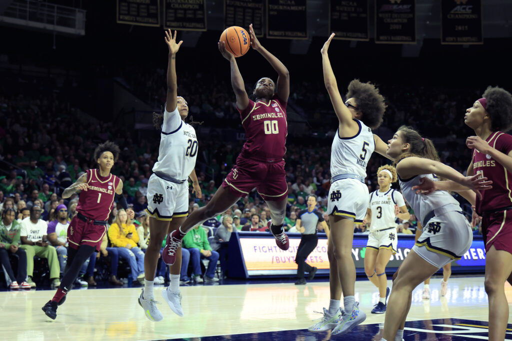 Notre Dame's Liatu King and Olivia Miles try to defend a shot from Florida State's Ta'Niya Latson during FSU's upset win over conference rival ND on Thursday.