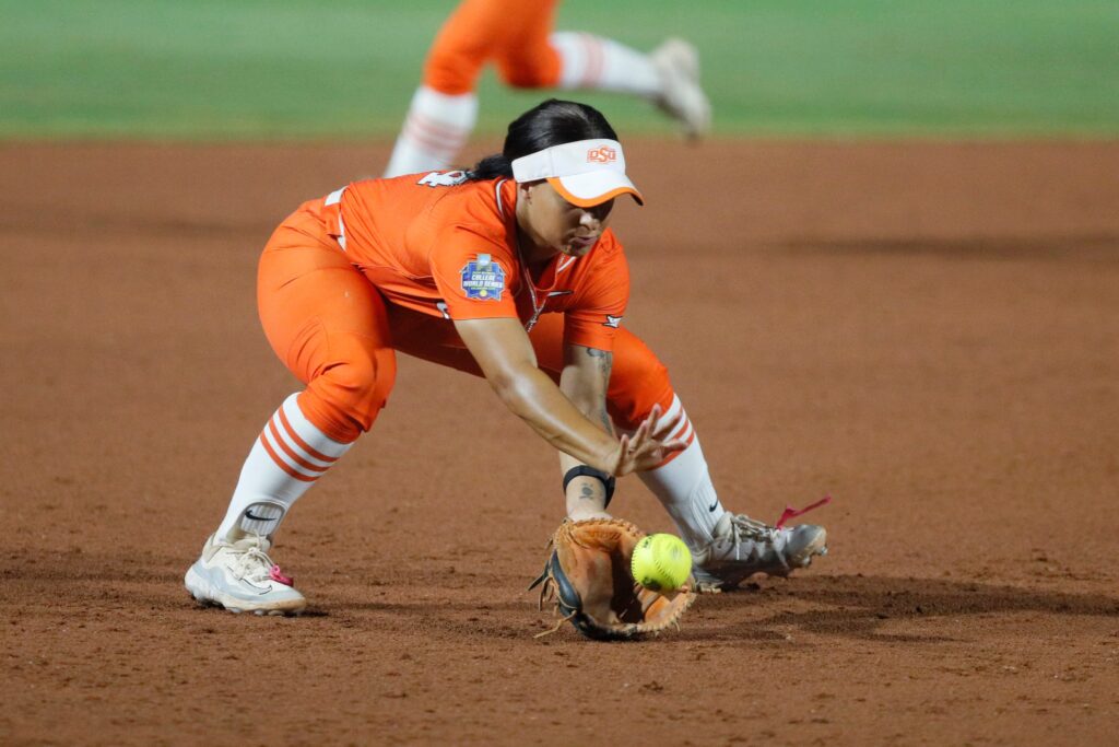 Oklahoma State's Tallen Edwards scoops a grounder at the 2024 Women's College World Series.