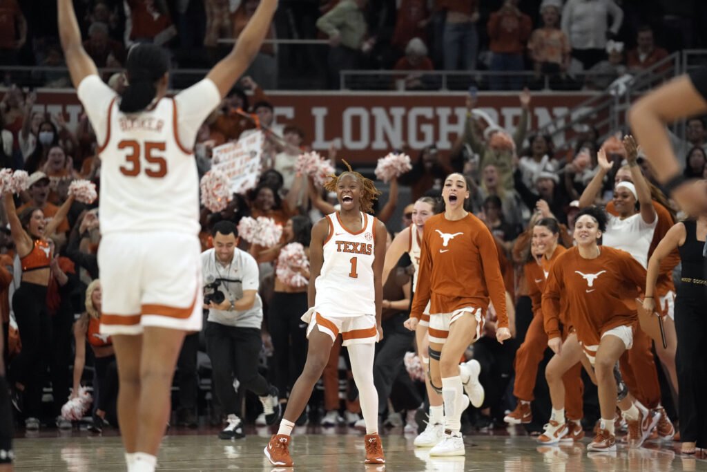 Texas basketball players celebrate their victory over South Carolina on Sunday.