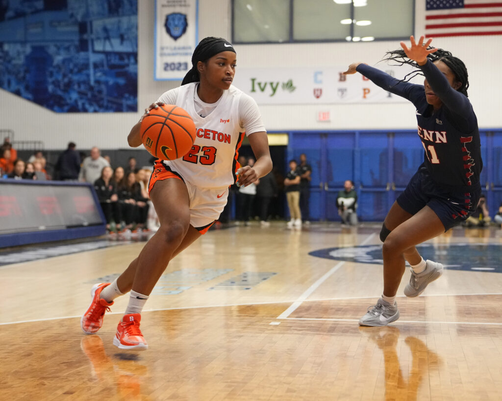 Princeton's Madison St. Rose dribbles past a UPenn defender during a 2024 Ivy League tournament semifinal.