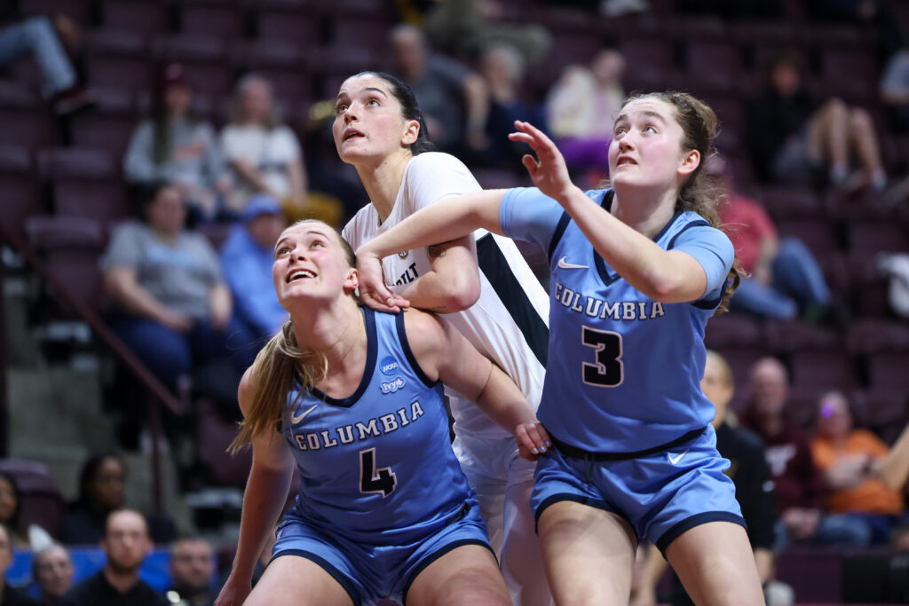 Columbia's Fliss Henderson and Cecelia Collins box out Vanderbilt's Justine Pissott during their 2024 NCAA Tournament First Four game.