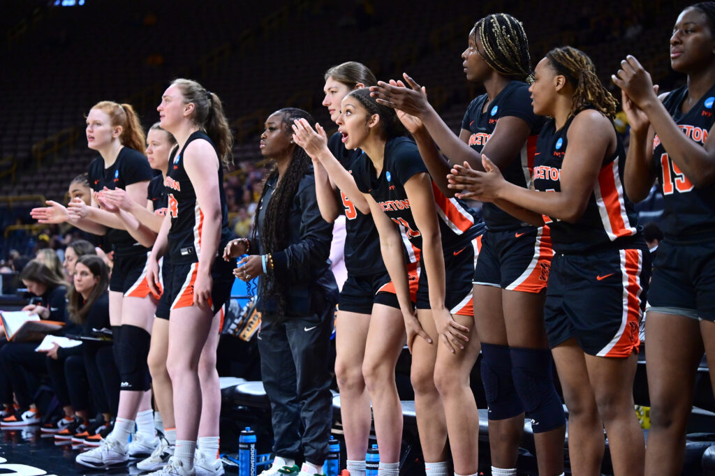 The Princeton bench celebrates a basket during the 2024 March Madness tournament.