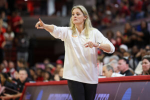 Kellie Harper points from the sideline while coaching Tennessee in the 2023/24 NCAA tournament.