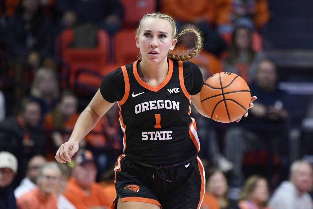 Oregon State guard Kennedie Shuler dribbles the ball up the court during a 2024/25 NCAA basketball game.