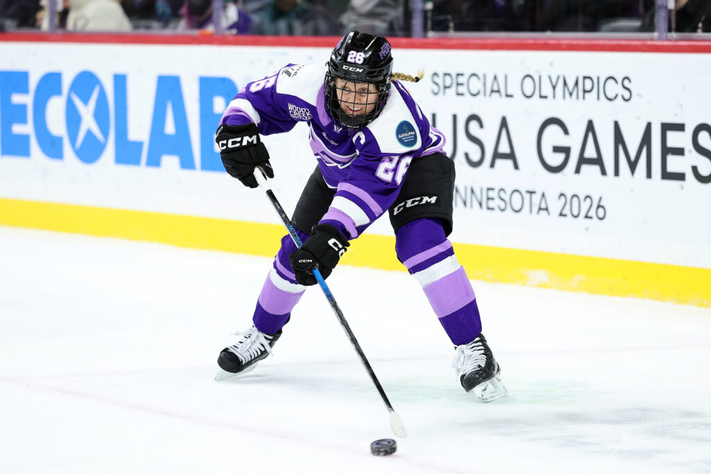 Minnesota Frost captain Kendall Coyne Schofield passes the puck during a 2025 PWHL game against the Boston Fleet.