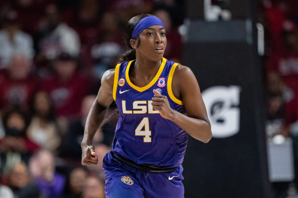 LSU star Flau'jae Johnson runs up the court during a 2024/25 NCAA basketball game.