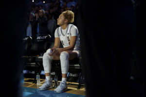 March Madness star UCLA Bruins guard Kiki Rice waits for her name to be called during introductions before the game against Ohio State.