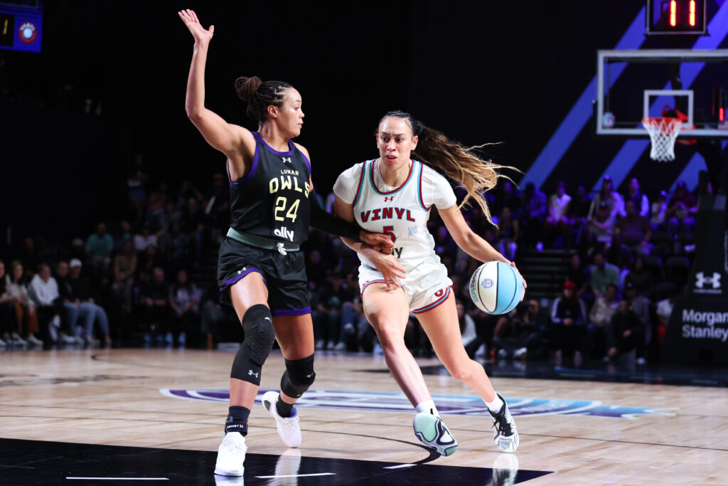 Vinyl's Dearica Hamby dribbles against Lunar Owls star Napheesa Collier during a 2025 Unrivaled game.