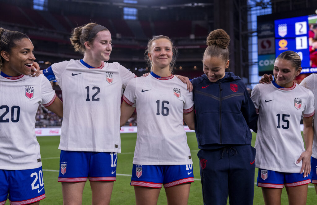 USWNT players including Tierna Davidson and Claire Hutton huddle up after defeating Australia at the 2025 SheBelieves Cup.