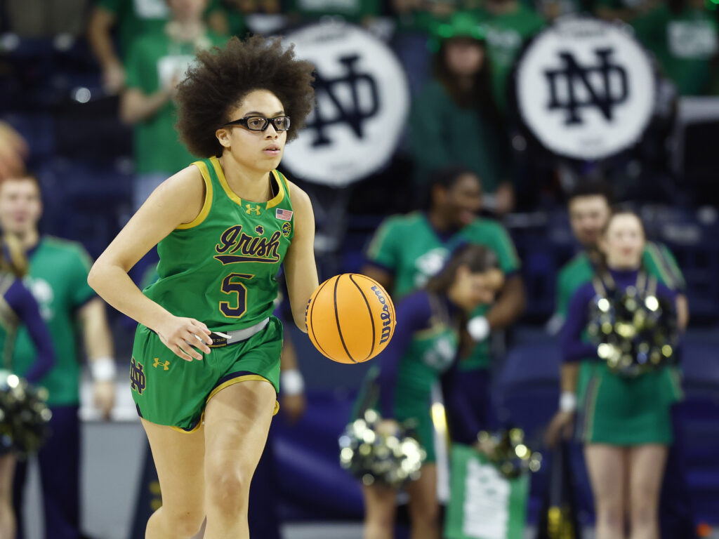 Notre Dame guard Olivia Miles dribbles the ball up the court during a 2025 NCAA basketball game.