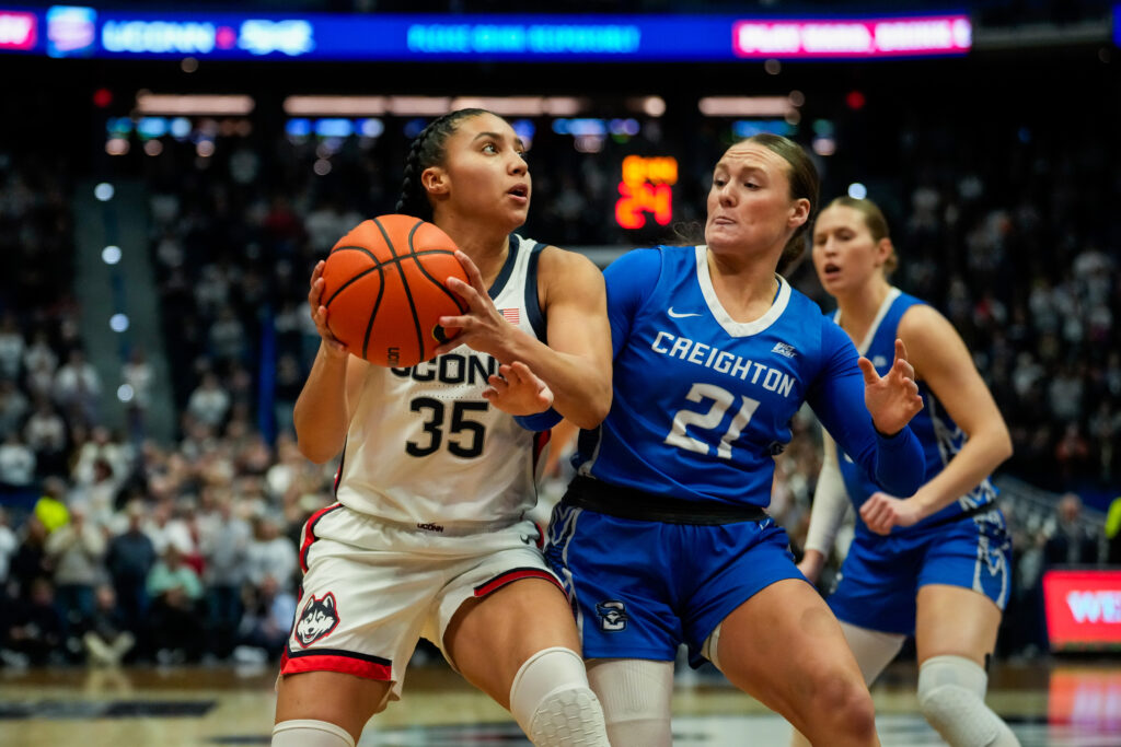 Creighton's Molly Mogensen defends UConn's Azzi Fudd during a 2025 Big East basketball game.