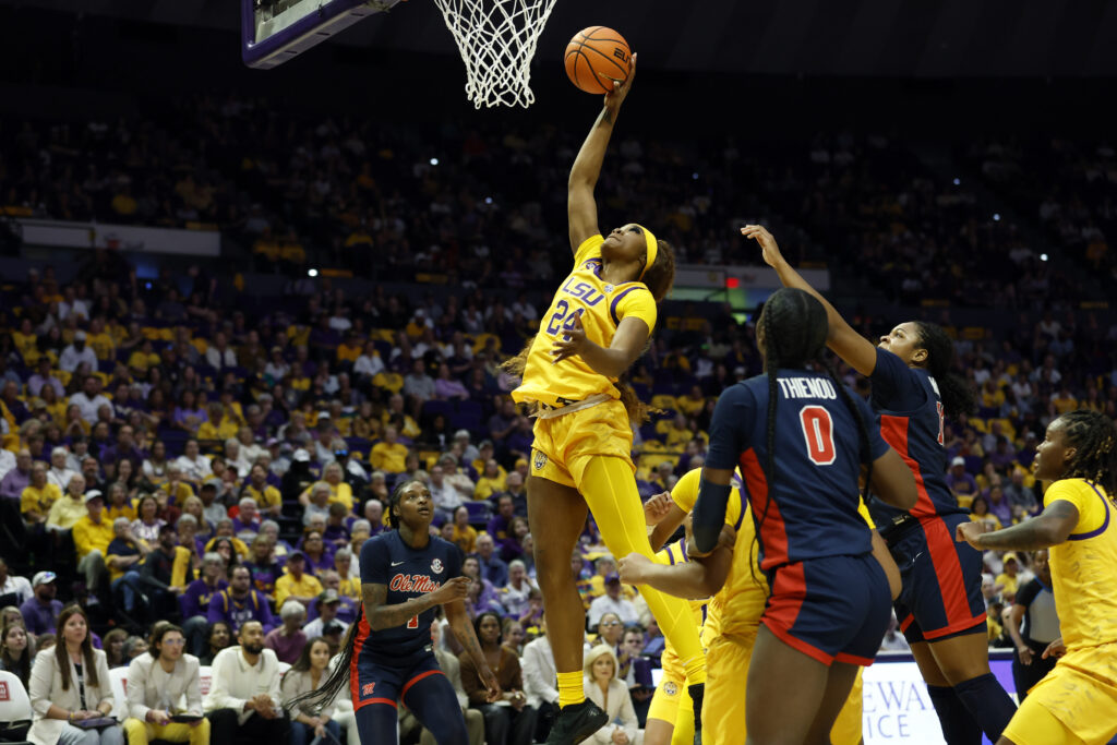 Naismith Defensive Player of the Year semifinalist Aneesah Morrow reaches for a rebound during LSU's 2024/25 regular-season finale win over Ole Miss.