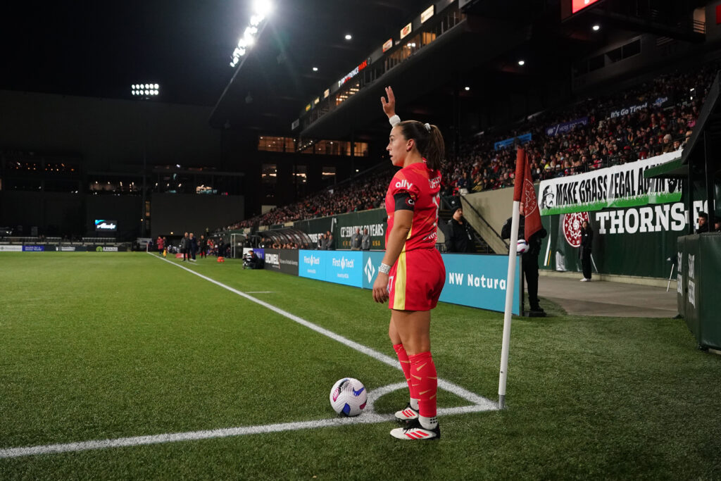 Portland star Sam Coffey prepares a corner kick during a 2025 NWSL preseason match against Utah.