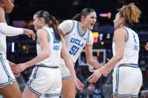 Lauren Betts and UCLA basketball celebrate a 2025 Big Ten tournament win.