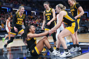 INDIANAPOLIS, INDIANA - MARCH 7: Hannah Stuelke #45 of the Iowa Hawkeyes celebrates with team members during the game against the Ohio State Buckeyes in the Big Ten Women's Basketball Tournament quarterfinals at Gainbridge Fieldhouse on March 7, 2025 in Indianapolis, Indiana. (Photo by Michael Hickey/Getty Images)