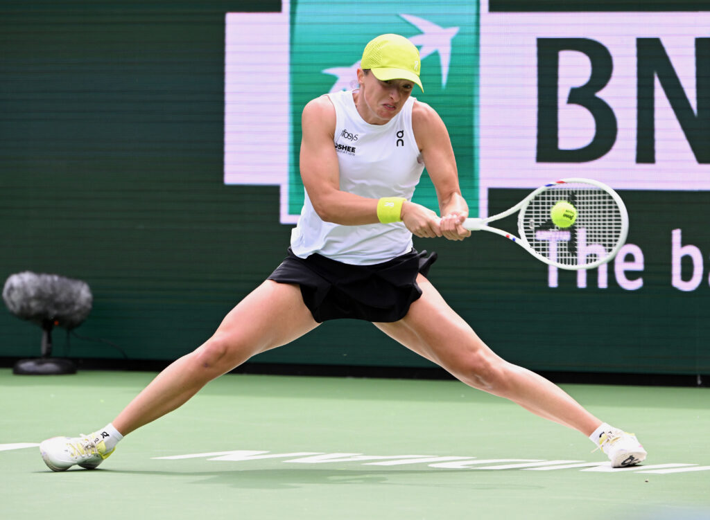 World No. 2 tennis player Iga Świątek returns the ball during a 2025 Indian Wells match.