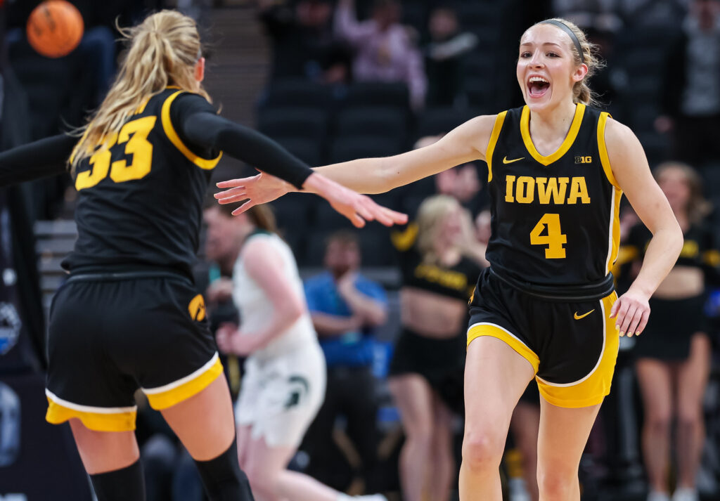 Iowa's Lucy Olsen and Kylie Feuerbach celebrate during a 2025 Big Ten tournament game.