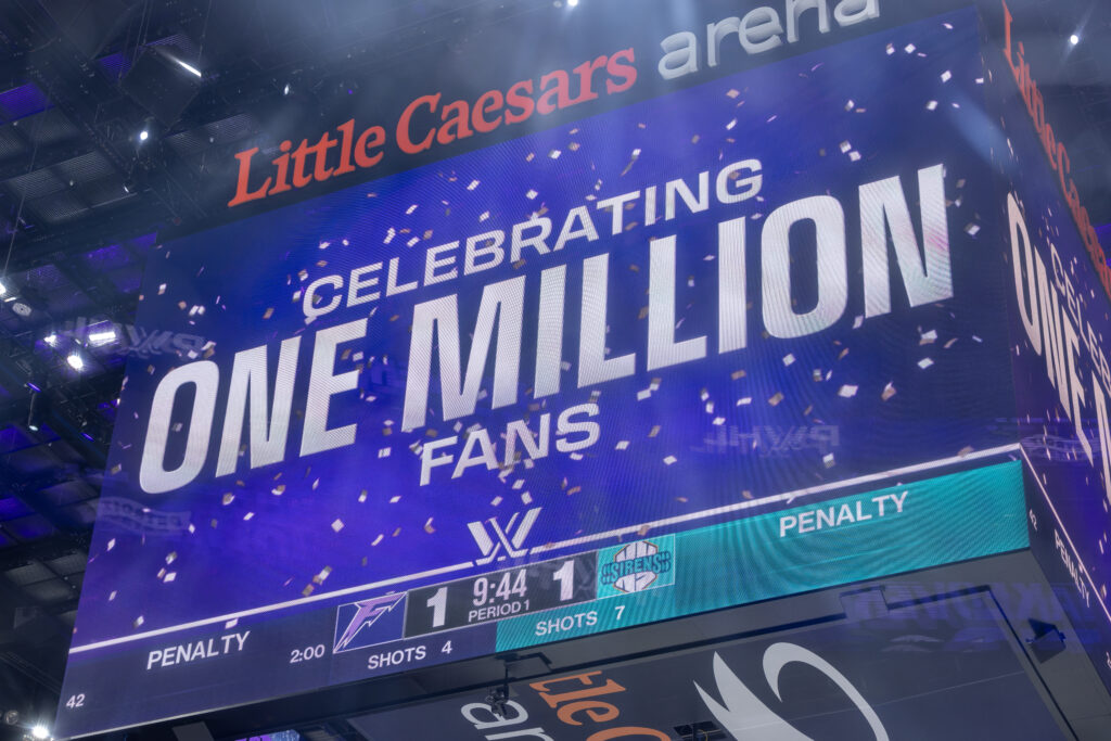 Detroit's Little Ceasars Arena scoreboard announces the PWHL one million fan attendance mark on Sunday.