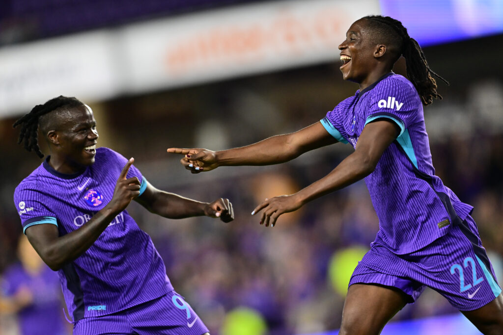 Orlando's Barbra Banda celebrates teammate Prisca Chilufya's goal during their 2025 NWSL season opener.