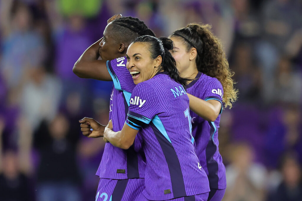 Marta and Angelina celebrate Barbra Banda's goal during Orlando's 2025 NWSL Kickoff win over Chicago.