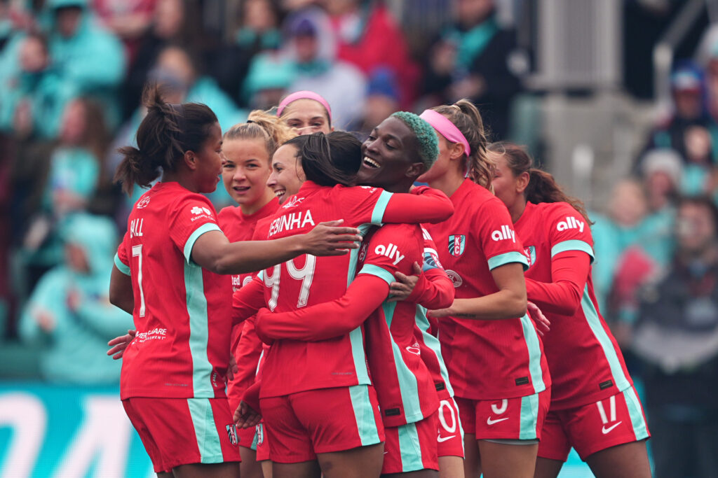 Temwa Chawinga celebrates with her KC Current teammates after scoring in their 2025 NWSL season opener.