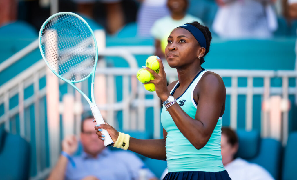 US star Coco Gauff hits tennis balls to fans after her 2025 Miami Open Round of 64 victory.