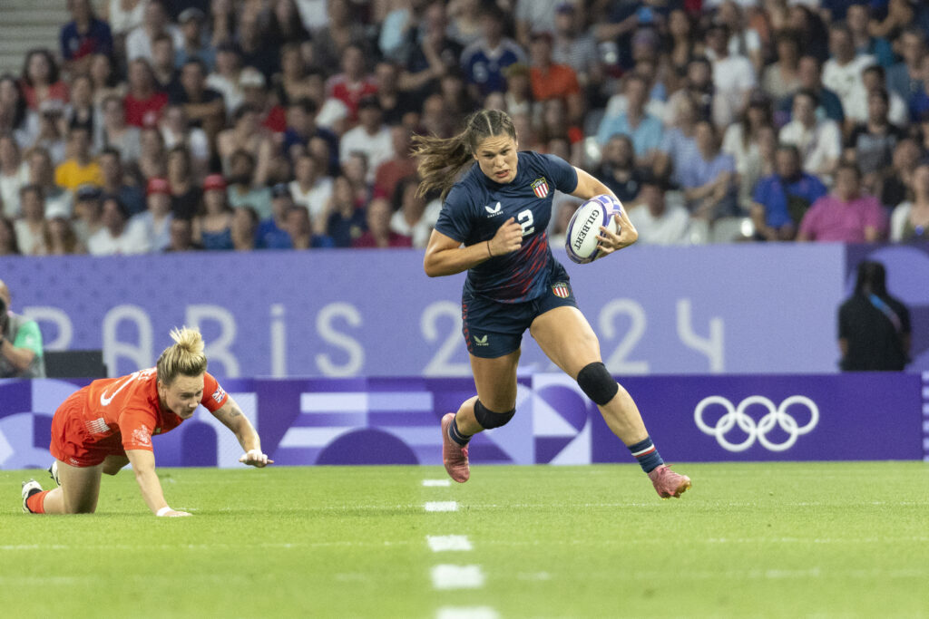 USA Rugby star Ilona Maher carries the ball during a 2024 Olympics quarterfinal against Great Britain.
