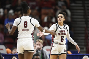 South Carolina's Joyce Edwards and Tessa Johnson high-five during a 2025 NCAA basketball game.