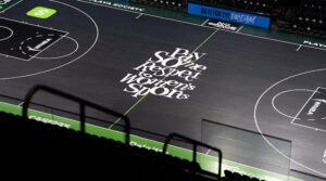 The new Atlanta Dream court reads "Pay Some Respect to Women's Sports"