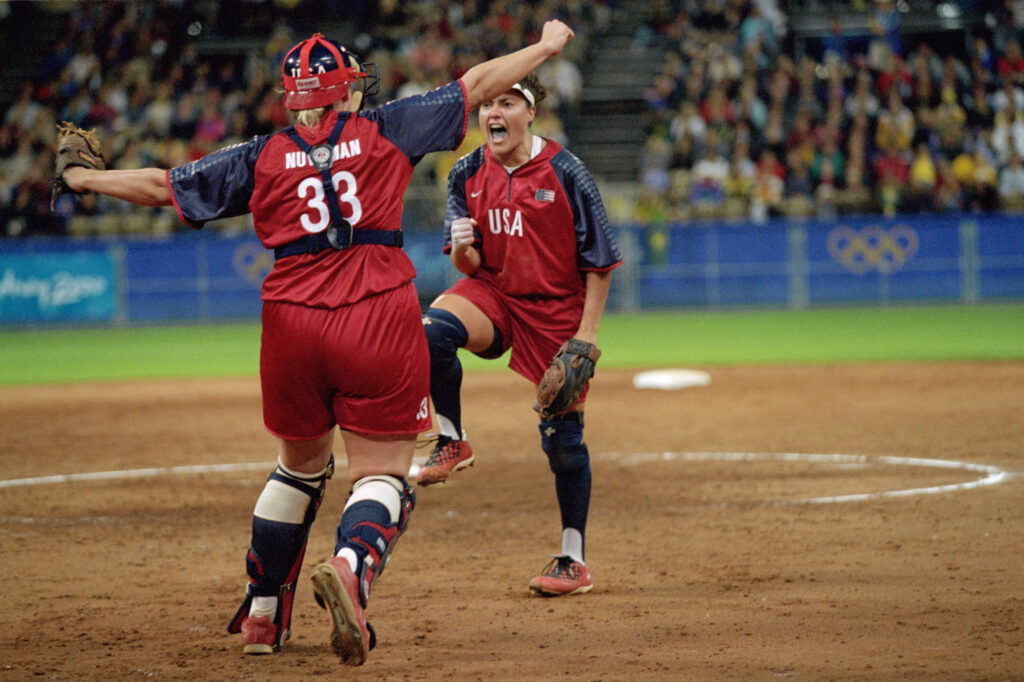 Team USA catcher Stacey Nuveman and pitcher Lisa Fernandez celebrate a no-hitter at the 2000 Olympics.