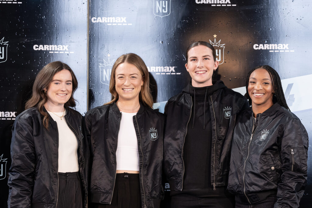 USWNT stars Rose Lavelle, Emily Sonnett, Tierna Davidson, Crystal Dunn pose after Gotham FC introduced them as players on the team's 2024 NWSL roster.