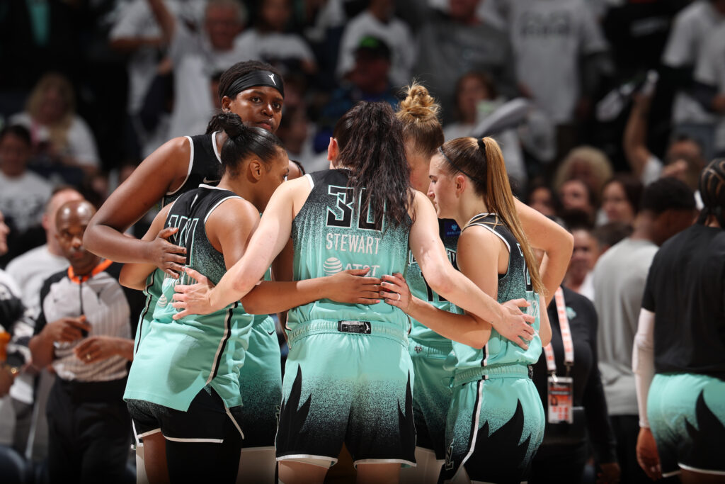 The New York Liberty huddle during a 2024 WNBA Finals game.