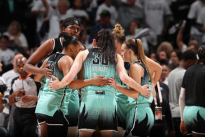 The New York Liberty huddle during a 2024 WNBA Finals game.