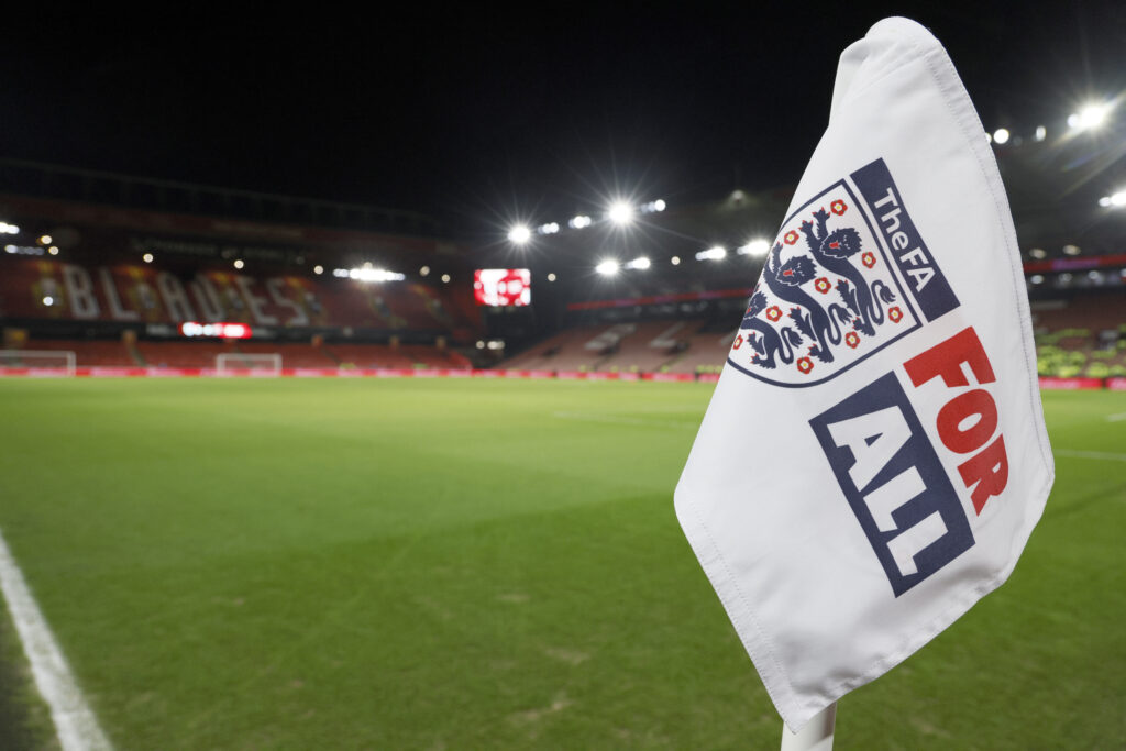 The FA "For All" corner flag flies on the pitch before a 2024 international friendly between England and Switzerland.