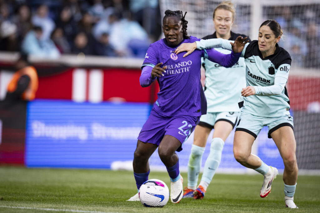 Orlando's Barbra Banda and Gotham's Esther battle for the ball during a 2025 NWSL match.