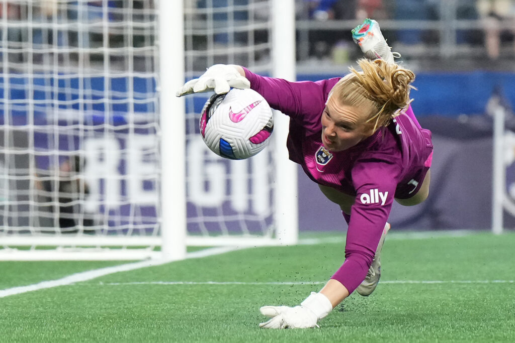 Seattle goalkeeper Claudia Dickey makes a save during a 2025 NWSL match.