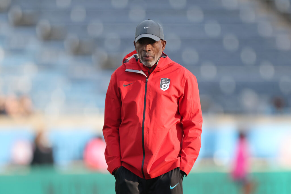 Chicago Stars head coach Lorne Donaldson stands on the pitch before a 2025 NWSL match.
