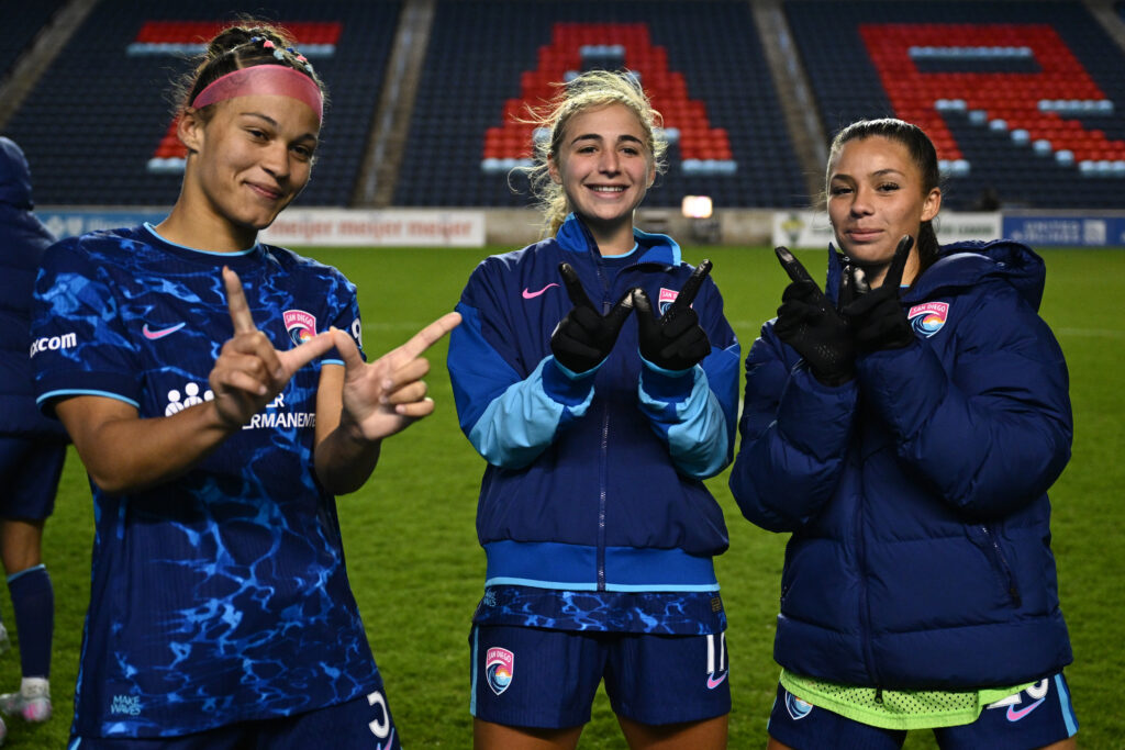 Trinity Armstrong, Kimmi Ascanio, and Melanie Barcenas celebrate a 2025 San Diego Wave win.