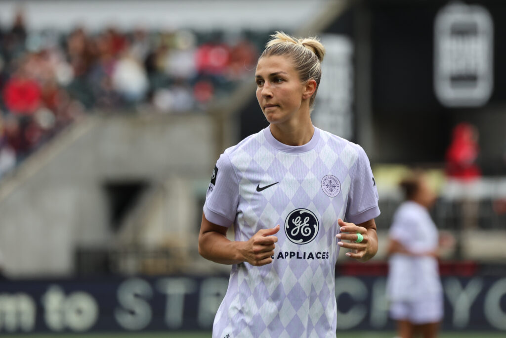 Racing Louisville midfielder Kayla Fischer looks on during a 2025 NWSL match.