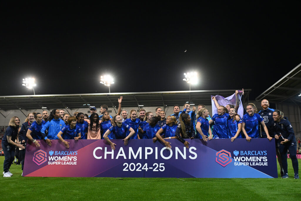 Chelsea players celebrate their 2024/25 WSL championship after a match.