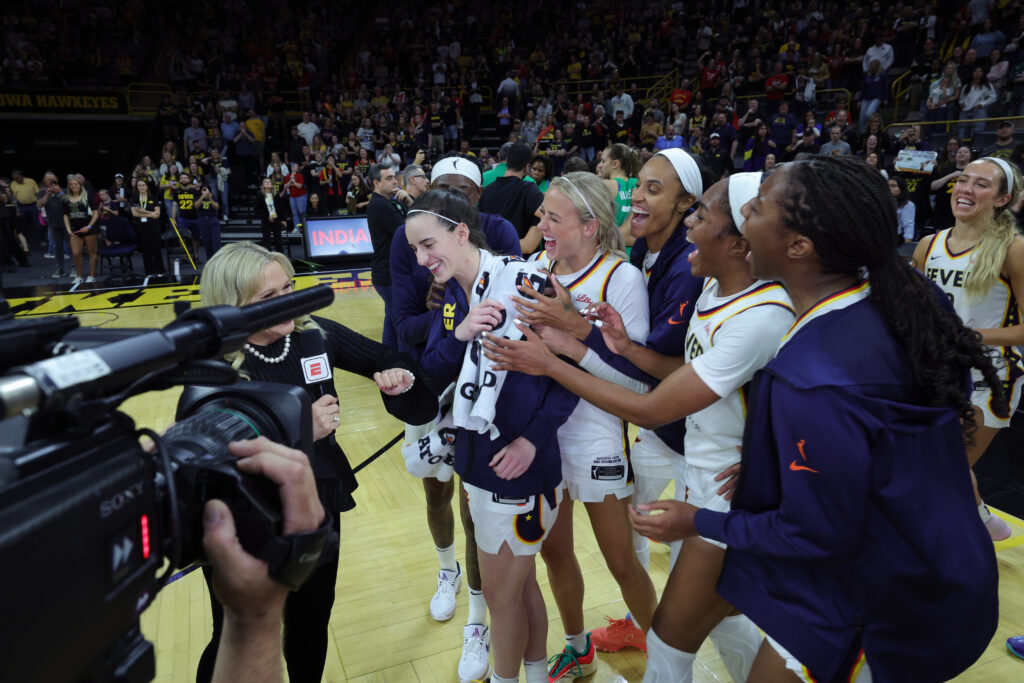 Caitlin Clark and her Indiana Fever teammates celebrate their big preseason exhibition win over Brazil on Sunday.