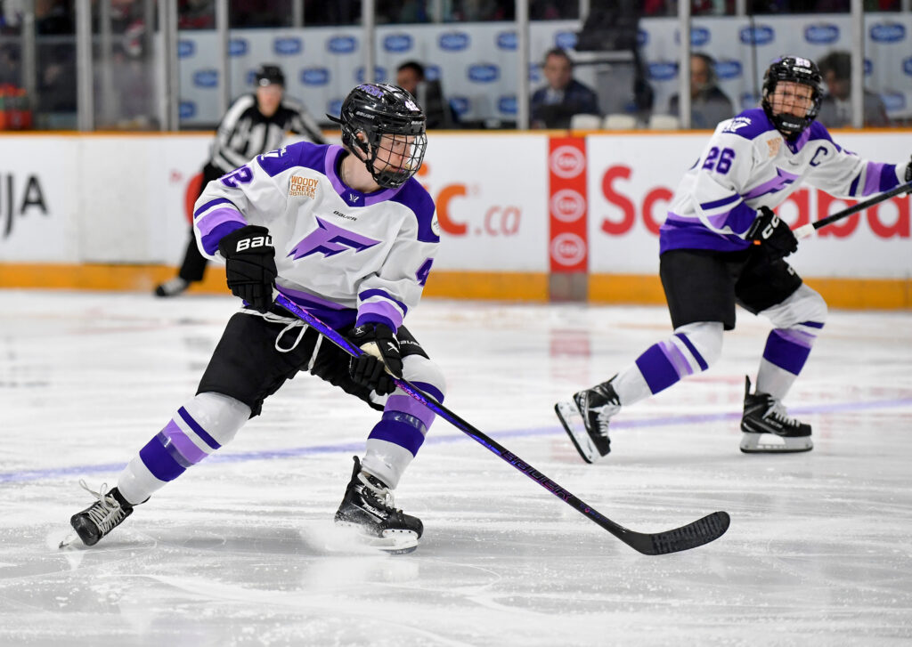 Minnesota's Claire Thompson and Frost captain Kendall Coyne Schofield skate against the Ottawa Charge during a 2025 PWHL game.