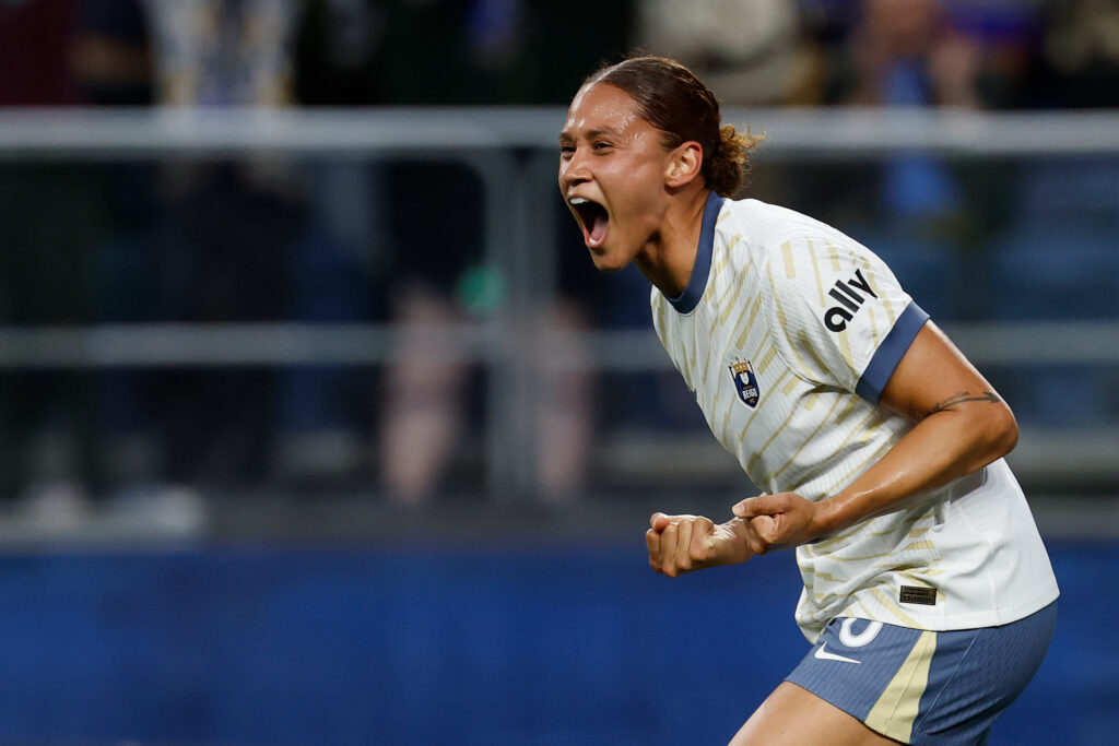 Lynn Biyendolo celebrates scoring her first Seattle Reign goal in Friday's NWSL match.