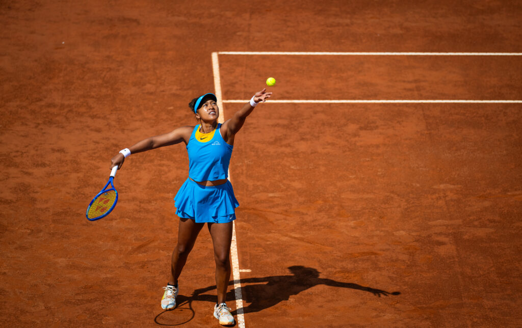 Naomi Osaka serves the ball at the 2025 Italian Open.