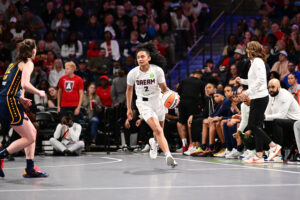 Atlanta rookie Te-Hina Paopao drives down the court during a 2025 WNBA preseason game.