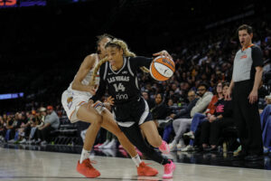 2025 WNBA draftee Harmoni Turner drives to the basket during a Las Vegas Aces preseason game.