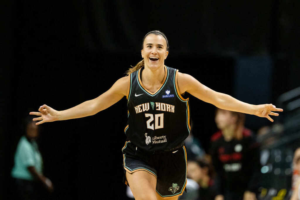 New York Liberty star Sabrina Ionescu celebrates a three-pointer during a 2025 WNBA preseason game.