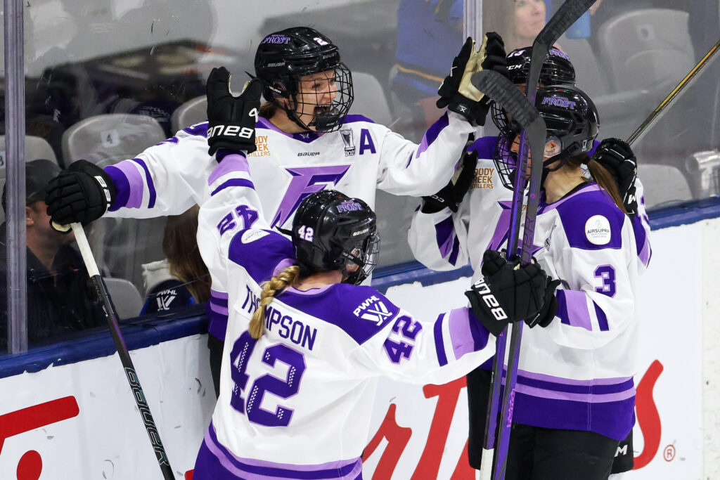 Defender Lee Stecklein celebrates a goal during the 2025 PWHL semifinals with her Minnesota Frost teammates.