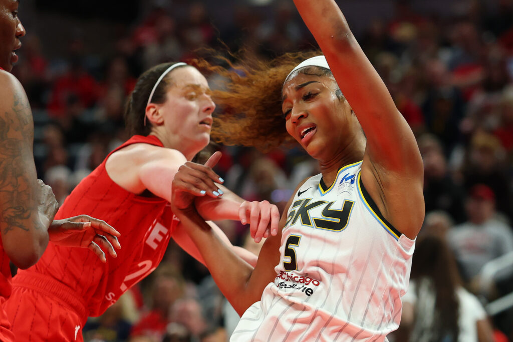 Indiana's Caitlin Clark commits a hard foul on Chicago's Angel Reese during their 2025 WNBA season opener.